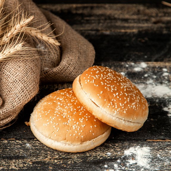 burger-buns-with-sesame-seeds-wheat-flour-table