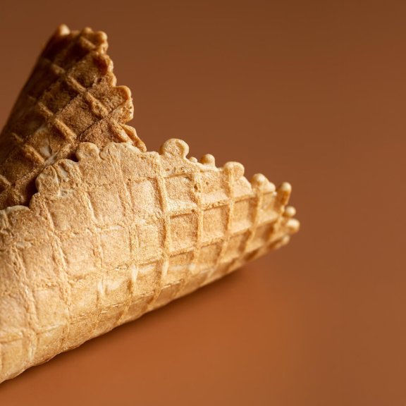 closeup-waffle-cone-creative-macro-concept-sweets-food_169016-28055