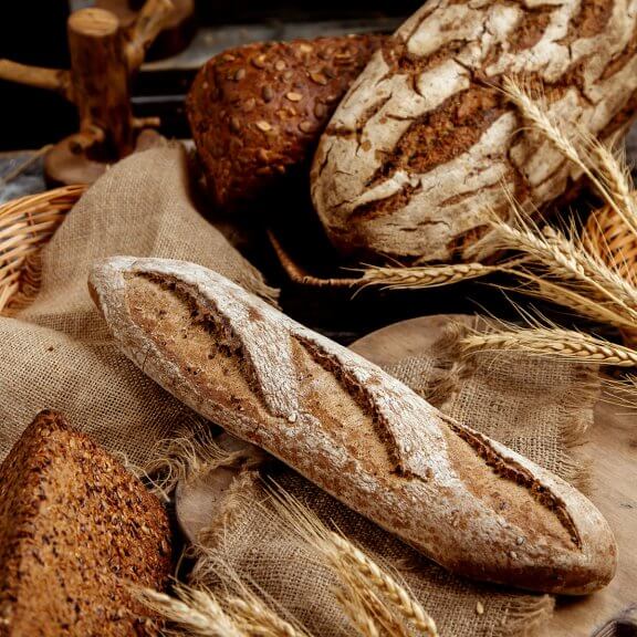 organic-whole-grain-baguette-placed-linen-fabric